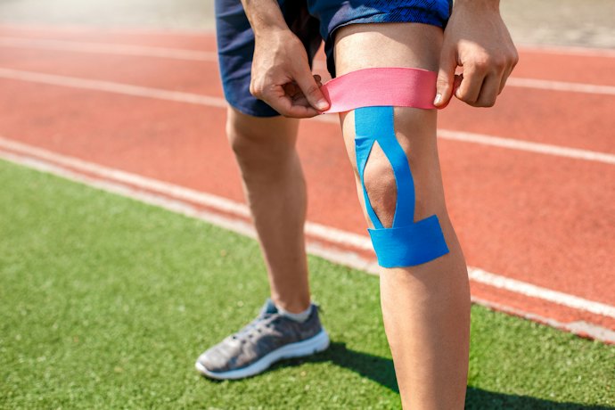 how does kinesiology tape work